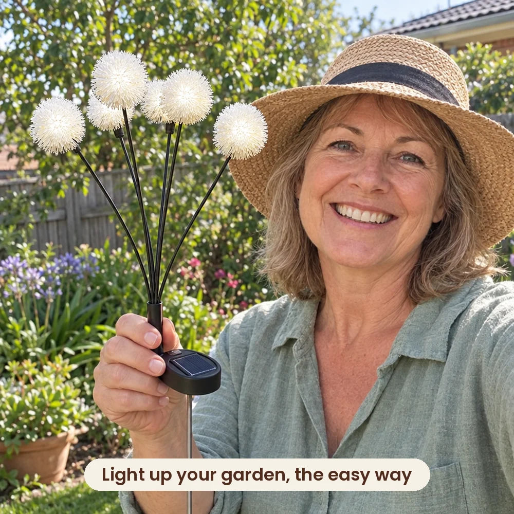 Woman holding HiLuci Dandelion Lights in her garden