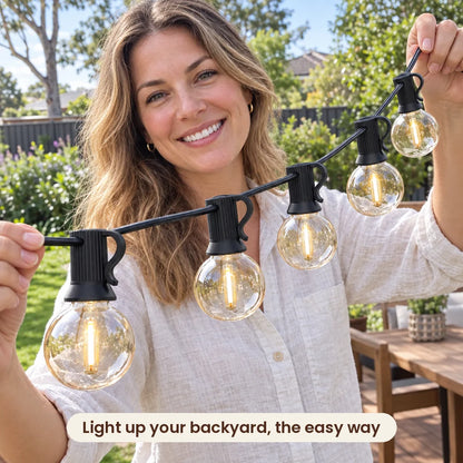 Woman holding HiLuci Globe Festoon Lights in her backyard