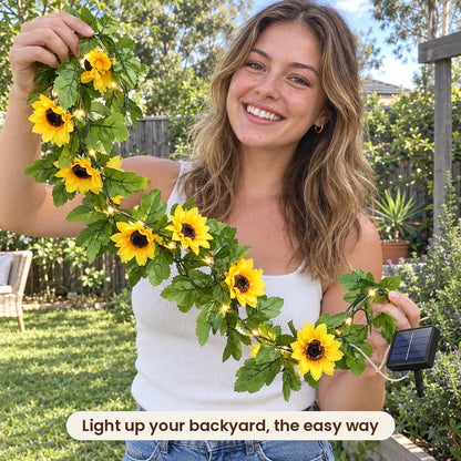 Woman holding HiLuci Vine String Lights in her backyard